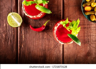 Bloody Mary Cocktail With Tomato Juice, Lime, And Celery, Overhead Shot On A Rustic Background With A Place For Text