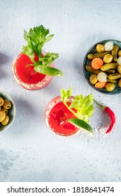 Bloody Mary Cocktail With Tomato Juice, Lime And Celery, With Pickles And Olives, Overhead Shot