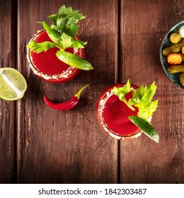 Bloody Mary Cocktail With Tomato Juice, Lime, And Celery, Square Overhead Shot On A Dark Rustic Wooden Background