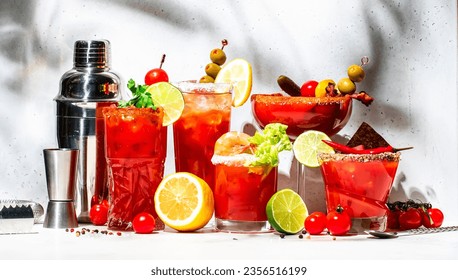 Bloody Mary, Joseph, Caesar and other cocktails variation with tomato juice, vodka, hot sauce and celery. Cocktail party. Gray background, hard light