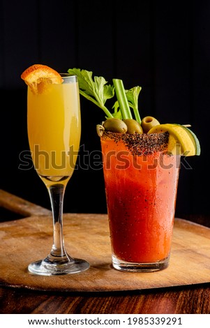 Bloody Mary and Mimosa. Classical American diner or French Bistro brunch cocktail. Spicy. Tomato juice, horseradish, hot sauce, fresh lime juice dash of Worcestershire sauce shaken served over ice.
