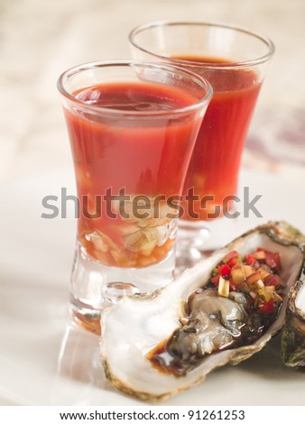 BloodY Mary or tomato juice with oyster, selective focus