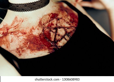 Bloody Pentagram On The Female Body Dressed In Black Dress