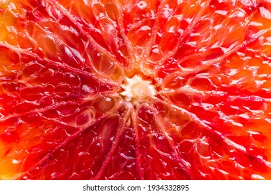 Bloody Red Sicilian Orange Pulp Texture Background. Macro Photo Of Red Orange Fruit. Citrus Friut Close Up