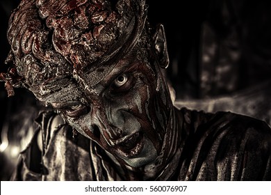 Bloody zombie man with brains out. Horror. Halloween.