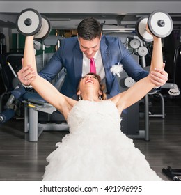 Bloom Helping Bride With Weights In The Gym