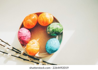 Blooming branches of the pussy willow and colored Easter eggs. Happy Easter and springtime - Shutterstock ID 2264492019