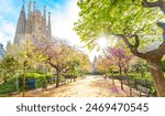 Blooming spring park in Barcelona city centre, Spain travel photo. Beautiful panoramic view of Barcelona cityscape, Sagrada Familia - famous architectural attraction on a background.