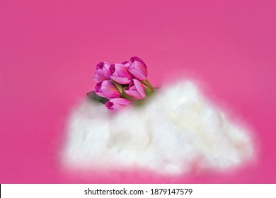 The Blooming Tulip Flowers On Top Of A Cloud On A Pink Bac