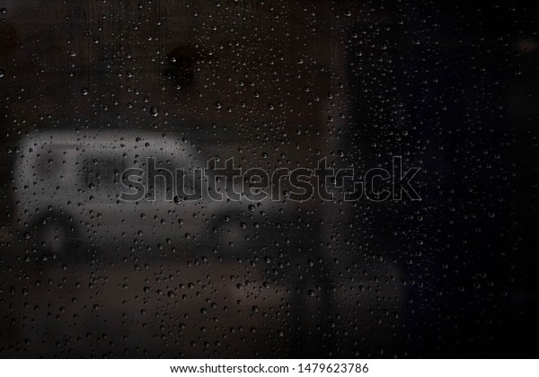 Bloomington, Indiana / USA - April 2019.  On a\
rainy day in the spring, I wanted to capture the parked car and the\
rain on the window