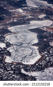 Bloomington, Minnesota. Aerial View Of Cracked Ice Formations On Pond In The Winter