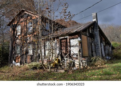 Bloomsburg, PA-USA-January 20,2021:  An Abandoned, Condemned Derelict Home In Bloomsberg Is Said To Have Ghosts.  Humming, Groaning Sounds Are Heard Through The Shuttered Windows.