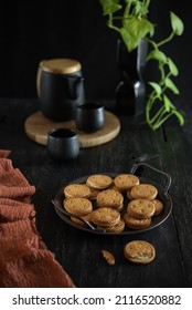 BLORA, INDONESIA – April 6, 2021: A Plate Of ROMA Brand Cookies Is Served On A Plate, Accompanied By A Glass Of Tea, Cookie Crumbs All Around. Selective Focus