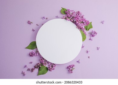 Blossom Syringa Vulgaris In Lilac Flower And Blank Paper Card For Text Message.Top View. Romantic Flowers Composition. Mock Up Frame With Lilac Flowers On Purple Background