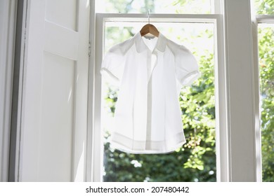 Blouse On Hanger At Domestic Window