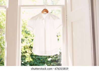 Blouse On Hanger At Domestic Window