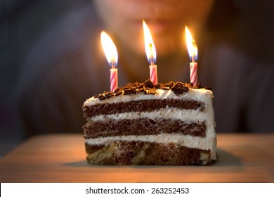  Blow out candles on birthday Cake - Shutterstock ID 263252453