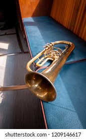 Blowing Brass Gold Wind Instrument On The Bench