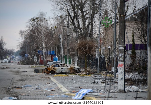 Blown up civilian cars next to residential\
buildings. Hostomel, Ukraine,\
06.04.2022