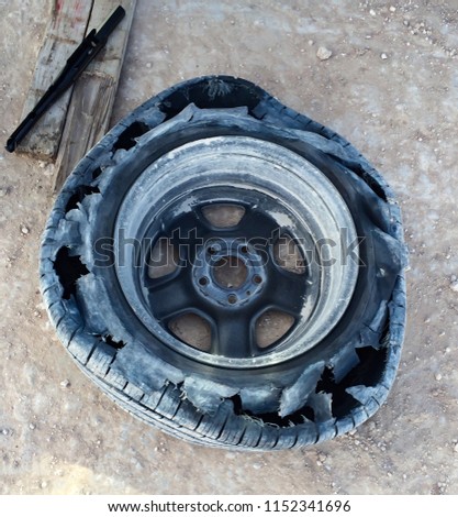 Blownout Tire Removed on the side of the rode 