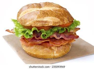 BLT Sandwich On Pretzel Bun. Isolated On White.