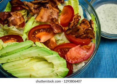 A BLTA Salad With Bacon, Lettuce, Tomato, And Avocado.