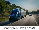 Blue 18 wheeler semi truck on the road	