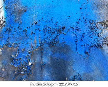 Blue Abstract Peeling Flacking Paint Texture On Exposed Urban Exterior Concrete Wall