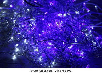 Blue abstract technical cable background with blue and purple lights, modern technological electrical high tech background