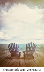 Blue Adirondack Chairs On Dock With Vintage Textures And Feel