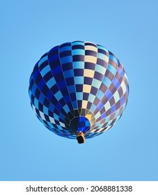 Blue air balloon flying in the clear blue sky. High quality photo