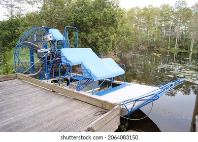 Blue Airboat Tied To A Dock In The Everglades Florida Swamp