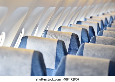 Blue Airplane Empty Seats With New Head Rest Covers