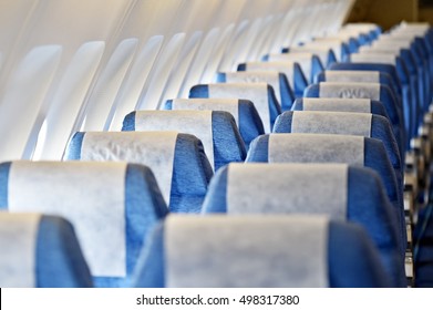 Blue Airplane Empty Seats With New Head Rest Covers