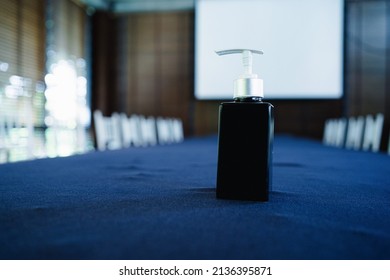 Blue Alcohol Gel Bottle Cleaning Hand On Table Meeting Room. Corona Virus Disease Covid-19 Prevention Hand Sanitizer Gel.