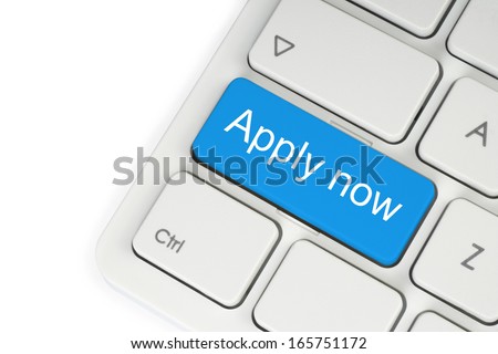Blue apply now button on white keyboard close-up  