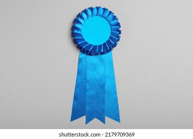 Blue Award Ribbon On Grey Background, Top View