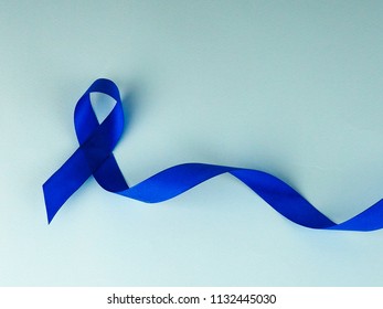 Blue Awareness Ribbon With Trail On Blue Background, Acute Respiratory Distress Syndrome (ARDS), Juvenile Arthritis And Tuberous Sclerosis Awareness Symbolic