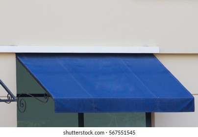 Blue Awning Over Glass Window