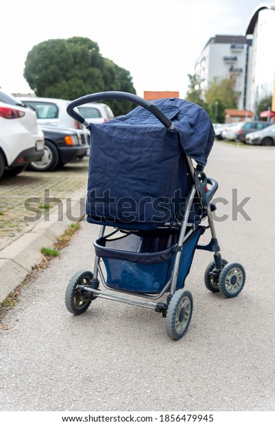blue baby stroller on the\
parking 
