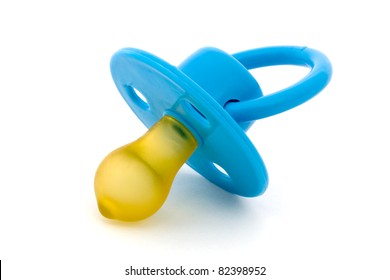 Blue baby's dummy isolated on white - Shutterstock ID 82398952