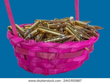 Blue background behind a bright pink Easter basket full of FMJ AR-15 ammunition from the Easter bunny.