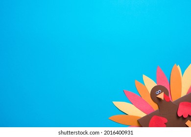 blue background with copy space. paper craft for kids. DIY Turkey made for thanksgiving day. create art for children.