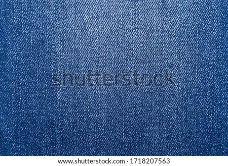 Blue background, denim jeans background. Jeans texture, denim fabric.
