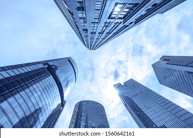 Blue background looking up at skyscraper