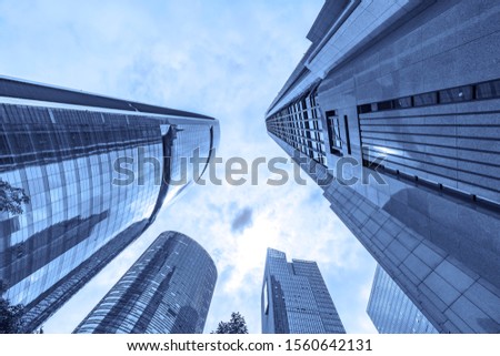 Blue background looking up at skyscraper