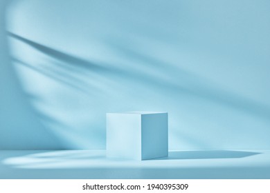 Blue background for product presentation with shadows and light. Empty cubic podium. Mockup. - Shutterstock ID 1940395309
