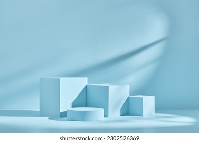 Blue background for product presentation with shadows and light. Empty podiums. Mockup. - Shutterstock ID 2302526369