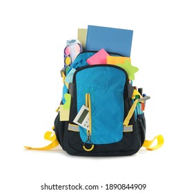 Blue backpack with different school stationery on white background