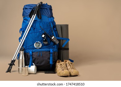 Blue Backpack And Hiking Boots. Mountain Gear Close Up